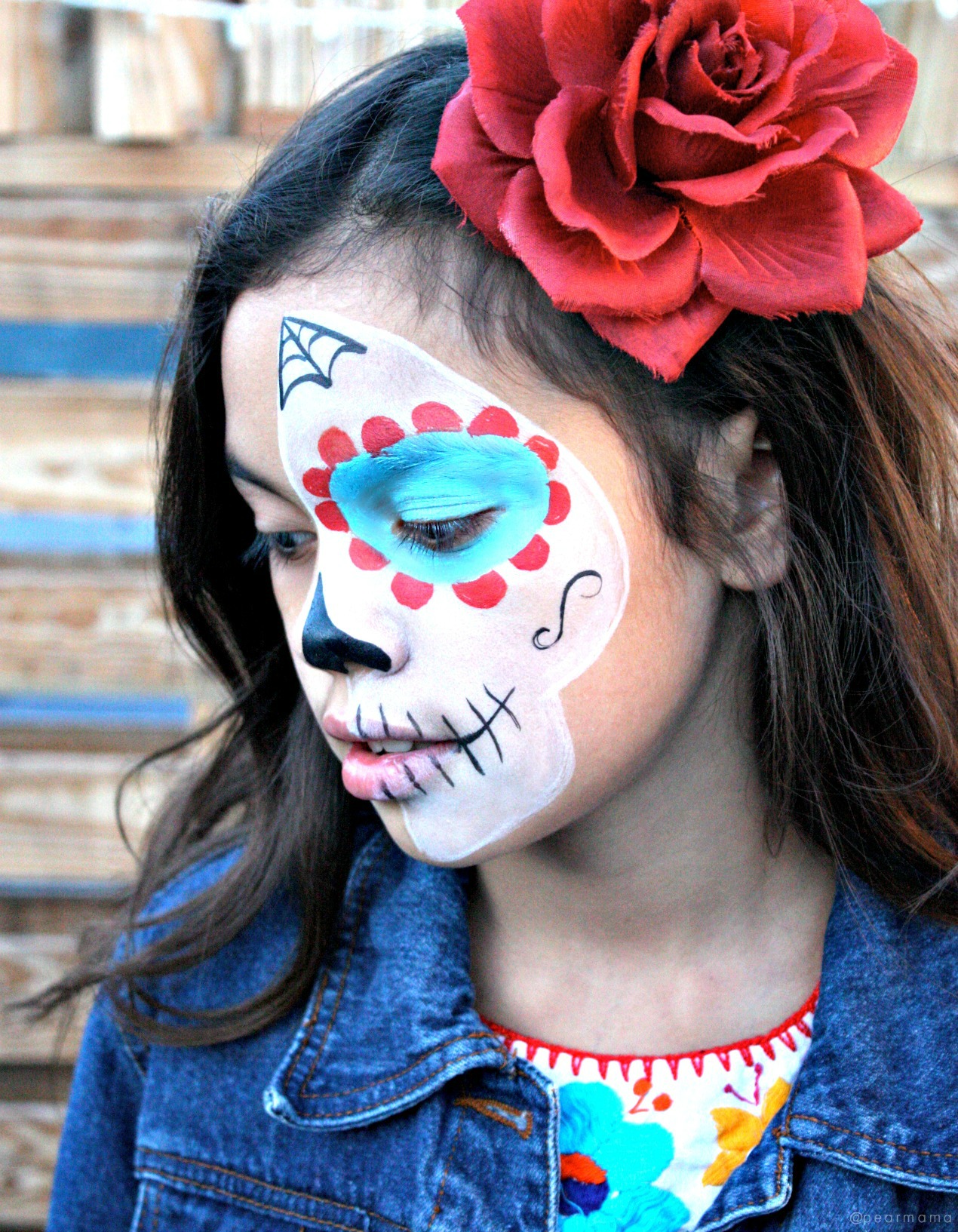 Watch this YouTube video and learn how to paint the perfect sugar skull makeup on your child to celebrate Day of the Dead.